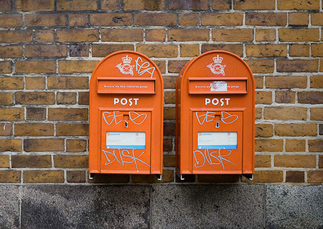 Two-red-colored-mail-boxes