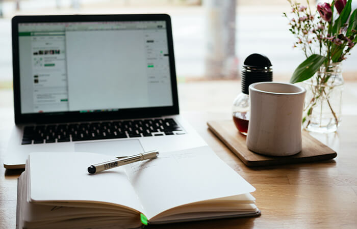 A-laptop-notepad-placed-on-a-wooden-table