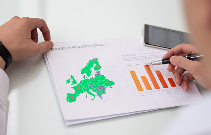 A-man-analyzing-data-on-infographic-chart